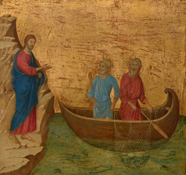 A man stands on a rocky, tan-colored outcropping and gestures to two men in a rowboat, all against a gold background in this square painting. The men’s pale skin is tinged with gray but they have rosy cheeks, and all three have beards. The outcropping rises steeply up along the left edge of the panel. The man who stands on it has long brown hair, a straight nose, and a small mouth. A halo is incised with geometric designs around his head against the gold background. He wears a crimson-red robe under a sea-blue mantle, both of which are edged with a line of gold. He holds up his blue robe with his left hand, farther from us, and holds out his other hand, palm up, to the other men. Those men stand in a wooden rowboat and hold a net heavy with fish over the side. Both of these men have ash-blond hair. The man to our left in the boat wears a sky-blue tunic and holds up one hand to his chest as he faces our left, his other hand holding a line of the net. The second man, to our right, has a longer beard and wears a brick-red robe. He holds the net with both hands, and looks up and to our left. The boat floats on a copper-green sea with several fish swimming in its undulating current. The fish are painted with dark green outlines. Closer inspection reveals two fish with gaping mouths facing us head on.