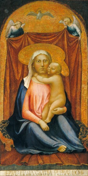 A woman holding a nude baby boy sits on a blue patterned pillow on the floor in front of a brick red curtain held up by two angels in this vertical painting. The people all have white skin with a green cast, though their cheeks are flushed with pale pink. The woman sits facing us and looks slightly off to our right. She has almond shaped eyes, a straight nose, and her lips are closed. She wears a blue cloak with a white hood over a shell pink dress. Her right arm, on our left, rests in her lap and she supports the baby with her other arm. The baby’s nude body is pudgy like a baby’s but his face and head are scaled more like an adult. His body turns towards the woman and he reaches up to her neck, and he looks into the distance to our left. Both have flat, plate-like gold halos. The winged angels holding up the red curtain also have halos and they wear blue robes. The curtain falls in gentle folds behind the mother and child, and fabric of the same color underneath the blue pillow on which they sit suggests that the curtain extends onto the floor. A dove, also haloed, floats at the top center of the painting. The gold background around the curtain and behind the angels and dove is painted into an arch over the people, and the upper corners of the panel are dark. A Latin inscription is painted with capital gray letters against a white band along the bottom edge of the panel: “AVE: MARIA: GRATIA: PLENA: DO.”