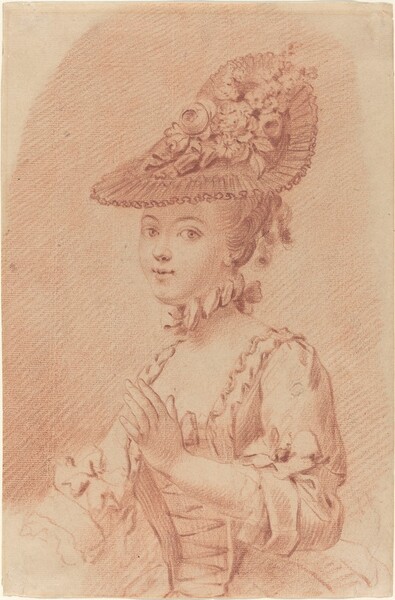 A Young Girl Wearing a Flowered Hat