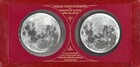 Two nearly identical black and white images of the lunar surface are encased in round openings in a rectangular, red holder. The edges of the holder are wrapped with tape or other material in a similar red color. The photographs are to either side of decorations and text in gold that create a vertical line up the center, between the photographs. Text along the top reads, “LUNAR PHOTOGRAPHS BY WARREN DE LA RUE F.R.S. Pres RAS.” An ornament like a downward pointing fleur-de-lis is printed beneath the text. An identical ornament pointing upward is placed above the bottom text which reads, “ENLARGED AND PUBLISHED BY SMITH BECK & BECK LONDON.” Each text block is enclosed by triangular shapes with inward curving sides and points that meet in the middle between the images of the moon.