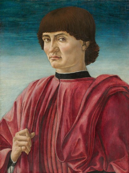 The head, shoulders, and chest of a man wearing a deep rose-red garment fills this vertical portrait painting. His body is angled slightly to our left, and he looks directly at us from the corners of his eyes. His brown hair falls across his forehead, sweeps down over his ears, and curls gently at the nape of his neck. His eyebrows arch over brown eyes, and he has a long, angular nose. His upper lip is full, and his mouth is closed. He has high cheekbones and a cleft in his chin. The high collar is a black band over the voluminous red garment, which falls in pleats or folds down his chest. His right hand, on our left, lifts to clutch the fabric near his chest, in the lower left corner of the painting, and he wears a gold ring on his pinky finger. The background behind the man fades from dark aquamarine blue across the top to pale arctic blue at his shoulders, which span the width of the composition.