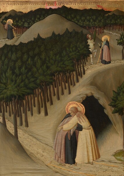 Three scenes showing the same person, Saint Anthony, are spaced along a path that winds from the lower right corner and around hills and trees into the distance in this vertical painting. In all three scenes, Saint Anthony has pale skin, a long white beard, and a halo framing a fringe of white hair around a balding head. He is barefoot and wears a black monk’s robe, and wears or carries a coral-pink cloak. Closest to us, in front of the mouth of a dark cave, Saint Anthony embraces a light-skinned, bearded man with long, curly blond hair. That man wears cream-white robes and also has a halo. Two walking sticks lie on the ground at their feet. The pebble-lined path disappears between stylized trees painted with smooth dark brown trunks and canopies created with pine and spring-green dots over a ground of forest green. To our right and farther along the path as it rises along the ridge of a hill, Saint Anthony meets a centaur, which has the torso and head of a man and the body and legs of a horse. The centaur holds a palm frond, and Saint Anthony raises one hand. On the opposite side of the hill, in the distance to our left, Saint Anthony walks along the path with a walking stick, and his pink robe hangs over a second long stick slung over his shoulder. Trees running along the background come nearly to the top of the panel, but a sliver of sky is painted gold, and the top edge is punched or embossed with a decorative pattern. Pale red shapes beyond the trees could be a building, perhaps a church, rising in the distance.