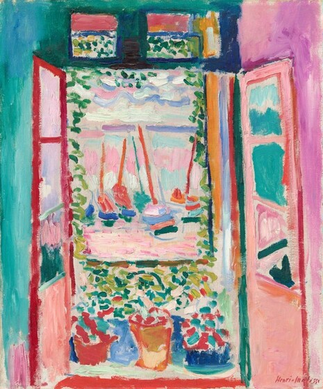 A French window with its sill lined with flowerpots opens into a view of boats floating in a body of water in this loosely painted, vibrantly colored, stylized, vertical painting. The doors open inward, and they are painted with coral orange and cranberry red. The wall behind the door to the left is peacock blue and the wall to our right is fuchsia pink, and those colors are reflected in the opposite windows of the doors. Three flowerpots in crimson red, marmalade orange, or royal blue sit on the windowsill in front of us. Foliage in the pots is painted with short strokes of cardinal red and turquoise blue. Over the window, a two-paned transom window pierces a forest-green wall. The view through the panes has a band of salmon pink across the top and dabs of celery green and banana yellow below. The dabs and dashes of pine and lime green continue down the sides of the window and across the sill, suggesting vines growing up around the opening. A band of ultramarine blue beyond the flowerpots could be a balcony. Several rust-orange masts of ships with hulls painted with swipes of indigo blue, flamingo pink, forest green, and marigold orange float in the water beyond. The water is painted with parallel strokes in pale pink and butter yellow. The sky above is painted with thick, wavy lines of steel blue, periwinkle purple, and seafoam green. The artist signed the work in red paint in the lower right, “Henri Matisse.”