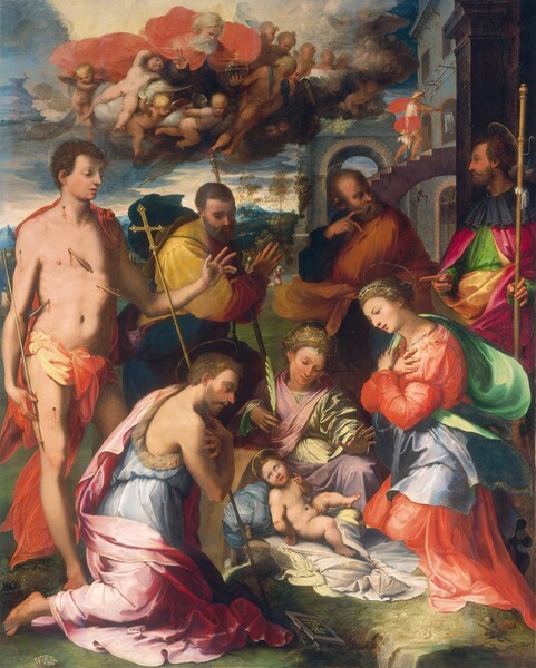 Five men and two women gather around an infant in a landscape in this vertical painting. The people all have pale or peachy skin with delicate facial features. Halos, like gold rings, float behind each head. All the men but one have beards, and most of the people’s lips are parted. The pudgy baby, Jesus, lies nude on a white cloth on the grassy ground near the bottom center of the composition. Three people kneel around and look down at him. To our left, a man wearing a fur-lined, powder-blue tunic under a rose-pink robe crosses his arms to touch opposite shoulders. A tall staff with a gold cross at the top rests in one elbow. Just behind Jesus, a woman wearing a gold crown and sage-green and pink robes holds a palm frond in one hand and extends the other over the baby. To our right, Mary wears a gold diadem and an apple-red dress. The cloak billowing behind her shoulders and fluttering to our right is emerald green on one side and silvery blue on the other. She also crosses her hands over her shoulders. Four men stand behind the group. Starting behind Mary, to our right, a man faces our left in profile. He holds a tall staff in one hand and points at Mary with the index finger of the other. The next man looks at the first with his hand held by his own face, the first two fingers splayed over his beard near his mouth. Next, another man looks down at Jesus with his hands together in prayer by the shoulder farther from us. These three men wear robes in canary yellow, burnt orange, dark blue, vivid green, or raspberry pink. The fourth man, along the left edge of the painting, is nude except for a coral-orange and yellow cloth tied around his hips. He has short brown hair and is cleanshaven. The feathered ends of three arrows project from his torso and three more wounds on his neck, shoulder, and thigh trickle blood. He holds an arrow by his side with one hand and reaches out with this other to hold the first two fingers and thumb up over Jesus. A gray stone building rises along the right edge of the composition behind the group. A person wearing a white tunic, red robe, and a straw-colored hat climbs a set of stairs there. That person holds a long staff over one shoulder and carries a lamb by the animal’s four legs in the other. In the sky above the main group, a bearded man a triangular halo over gray hair floats among about a dozen winged, child-like angels on a cloud bank. The man holds up one hand in blessing and holds an orb topped with a cross in the other hand. A bank of winged baby heads clusters in the distance, farther along the cloud bank. A few people, tiny in scale, sit or walk through the landscape, which leads back to ice-blue, craggy mountains. Cream-white and muted blue clouds fill the sky above. The artist signed the work as if he had left an inscribed tablet near Jesus. It reads, “M.D.XXXIIII. PERINO BONAC CORSSI FLORENTIN OPVS FACEBA.” The letters of the artist’s name, PERINO, are then combined into two monograms.