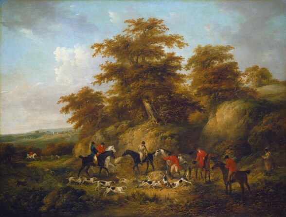 A hunting party with eight men mostly on horseback and nine dogs gather around a fox being attacked by two dogs in this horizontal landscape painting. The men wear or hold black caps and have jackets in cardinal red or parchment white, and one is in teal blue. The horses are silvery white, chestnut brown, or black. At the center, near the fox, one man dismounts, and another stands to our right of the group. The hounds are white with black and tan spots, and they rush toward the rust-brown fox. The hunters and dogs form a loose line across a grassy area, which is backed with a steeply rising but low hill, topped by trees with feathery canopies. The grass and leaves are painted in tones of sage green and harvest gold. A smudge of brick red in a crevice of the hill could be a person watching from the shadows. One rider on a white horse gives chase in the distance to our left, and the land dips down and back to row of houses along the crest of a rolling hill. Thin screens of white and pale gray clouds float across a pale blue sky above.