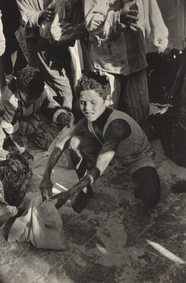 David Seymour (Chim), Scraping Up Flour at a Looted Depot, Port Said, 1956