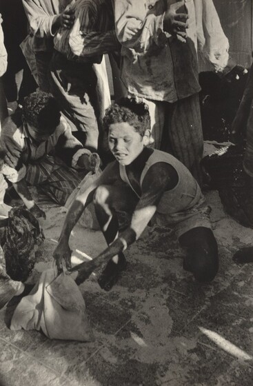 Scraping Up Flour at a Looted Depot, Port Said (Suez Crisis)