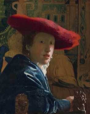 Shown from the elbows up, a young person with pale skin and brown hair wearing a wide, scarlet-red hat sits in front of a tapestry in this vertical portrait painting. She sits with her body facing our right in profile but she turns her face to look at or towards us from dark eyes. She has a rounded nose, rather flat cheeks, and a sliver of teeth is visible through parted coral-pink lips. The wide brim of the red hat seems to be made of a soft, almost feathery material, and it casts a shadow across her face. She wears a high-collared white garment that catches the light, a royal blue, possibly velvet robe or overcoat, and large, teardrop pearl earrings. Her arm runs along the bottom edge of the panel in front of two carved wooden lion finials that could be the arm or back of the chair. The tapestry behind her is painted in tones of pale caramel brown and pine green. The painting has a soft, hazy look and light glints with bright white specks off the pearl earrings, the tip of her nose, her lips, and the lion finials.