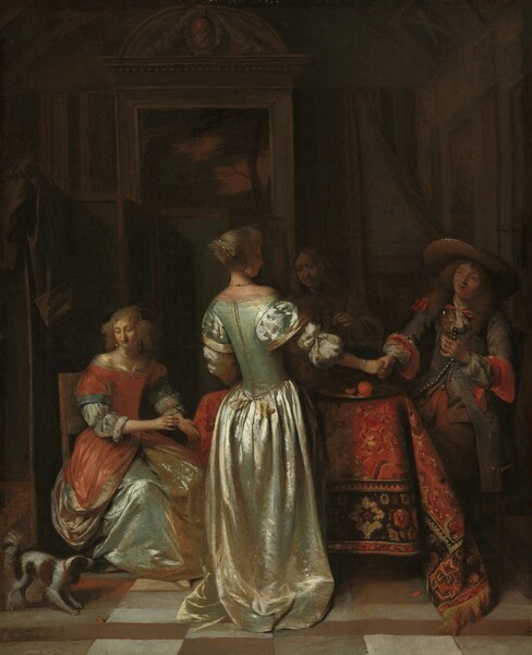Four elegantly dressed men and women, plus a brown and white dog, gather around a rug-covered table in a shadowy room in this vertical painting. The people all have pale skin and are lit from our left. The women have blond hair and wear long silk dresses, and the men have shoulder-length wavy hair. At the center of the painting and closest to us, a woman stands with her back mostly to us, her body angled away to our right. Her face is in shadow, but we see the tip of a delicate nose. Her hair is pulled to the back of her head, and a few touches of white paint suggest a ribbon or ornament there. She wears pearl earrings, a pearl necklace, and a four-stranded pearl bracelet on the hand we can see. Her pale, mint-green dress drops off her shoulders and has a tight bodice. Puffy white sleeves of her undershirt are gathered at her elbows under the short, bell-shaped sleeves of the bodice. Her skirt falls in shiny folds and pools on the floor. The fabric reflects cream white where the light strikes the satin, and the shadows are cool, faint green. The woman holds her right hand out and clasps the hand of a cleanshaven man on the right side of the table. He smiles as he looks at her with wide-set eyes in a round face. He wears a broad-brimmed hat. His brown jacket is tied with a red bow at his throat and is red where the cuffs are rolled back. The white shirt he wears beneath is visible at his neck and in voluminous sleeves at his wrists. The jacket is lined with shiny buttons down the front, and it opens across his hips over red pants. He holds a glass with amber-colored liquid up in front of his chest with his other hand. A man between the pair is deep in shadow in the background. He holds up one hand as he looks down and to our left, a faint smile on his lips. The fourth person, another woman, sits to our left on our side of the table. Her hair is gathered in bunches over each ear. She also wears pearl earrings and a necklace. Her dress is red over an ice-blue skirt, which has bands of gold down the front and around the bottom hem. She holds both hands up near the table, to our right, as she looks down at the dog in the lower left corner of the composition. The dog has brown and white spots, a feathery tail, long brown ears, a white muzzle, and it stands tensed, its head lowered a little as it looks up toward the table. The rug covering the table is patterned with crimson red, black, and tan. A silver dish holds an orange-colored piece of fruit at the front right corner of the table. A landscape painting hanging on the back wall behind the group is framed in architectural molding. Details are difficult to make out in the shadowy background but there seems to be an olive-green screen behind the seated woman, with a piece of cloth, perhaps a coat, flung over the top. The floor is tiled with brown and white squares. The artist signed the work as if a coat-of-arms over the landscape painting is painted partially with his name: “P HOO.”