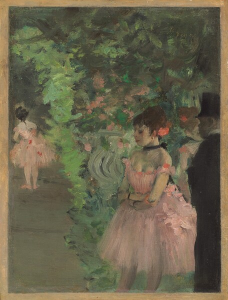 We seem to look slightly down onto a loosely painted scene with at least three ballerinas and one man, wearing a black suit and top hat, against a backdrop of lime, mint, and pine greens in this vertical painting. The people all appear to have light skin. The most defined person is the woman closest to us, shown from the knees up to the right of center. Her body is angled to our left and her profile faces that direction. Dark eyelashes suggest her eyes are closed. She has a pointed nose and her rose-red lips are closed. Dark brown hair is pulled up into a large bun with a coral-pink flower tucked in at the back of her head. She grips opposite elbows at her waist, her arms close to her body. Her petal-pink costume has a low-cut bodice with loops low over her shoulders and a flaring, knee-length skirt. She wears a black choker tied with a bow at the back of her neck and two black bands encircle her wrists. A touch of white at the ear we can see suggests a gold earring. To our right and cut off by the right edge of the painting, a man stands beyond the woman’s shoulder, in shadow as he looks onto the scene. His face is painted with taupe-gray strokes and he seems to be cleanshaven. His suit and top hat are black except for a narrow white collar at his neck. Beyond this pair and seen from the chest up between them, another woman in the same pink costume seems to stand facing our right. A distance from us to our left, a third ballerina, also with the same costume, stands facing away from us and seems to tip her torso slightly to our left or might lean forward. The elephant-gray floor she stands on visually creates a vertical band up the left side of the composition. The rest of the space behind and around the man and dancers is painted loosely with shades of vibrant to muted greens, with a few dabs of pale pink. The painting has a narrow sand-colored border. The artist signed the work by incising into the green paint in the upper right corner, “Degas.”
