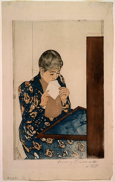 We look slightly down onto a young woman sitting at a writing desk as she licks an envelope in this vertical, color print. A table folds down or extends from a tall secretary desk to our right. The blotter on the table and the woman’s long dress are both navy blue. The dress has a vaguely floral pattern in tan, and the jacket is open to reveal a vertically pleated, tan shirt beneath. The woman’s skin is pale peach. Her black hair is pulled back over dark brows and a delicate nose. She holds the open flap of the envelope to her mouth with both hands. The rest of the room is white with a few lines to indicate a corner and a chair. The artist signed the print under the lower right corner, “Mary Cassatt etat.” Another graphite inscription in the lower left corner of the sheet is indecipherable.