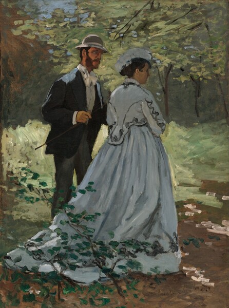 A woman wearing a long, slate-gray gown walks with a man wearing a suit and cap in a woodland setting in this vertical painting. Both people have pale, peach-colored skin. The scene is loosely painted so many of the details are indistinct. The woman walks away from us, angled to our right so we see her right cheek and the tip of her straight nose. Her lips are parted, and her dark hair is pulled back into a bun under a silvery-gray hat that curves over her head. The long-sleeved bodice is embellished with swirling black lines across the back of the neck, down along the arms and backs of the shoulders, and around the bottom. Her full skirt has a short train that trails behind her along the dirt path. To our left, a man stands with his body angled toward the woman, and us. He has short, dark hair under a rounded, brimmed, gray cap. His long sideburns connect with his full beard and mustache. The eye we can see is a dab of pale blue paint, and he looks at the woman.  He wears a navy-blue jacket over a white, collared shirt and white bowtie, and charcoal-gray pants. He reaches his left hand, farther from us, toward the woman, and he holds a short stick or staff in his other hand. Strokes of white on the dirt path suggest dappled sunlight filtering through the trees, which fill the rest of the composition. Leaves are created with swipes of celery and sage green, and trunks with lines of dark brown. A few touches of baby blue at the top center of the painting suggest a patch of sky through the dense canopies. The artist signed the lower right corner, “Claude Monet.”