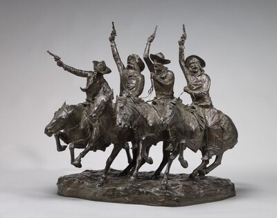 Four men on horseback riding side by side hold revolvers up in the air in this freestanding bronze sculpture. All four wear gloves with long cuffs and wide-brimmed hats. Their eyes are delineated as slits to suggest they are closed or nearly so, and their mouths are wide open. Their right hands, to our left, are raised holding revolvers in the air, and they hold the reins of the horses with their other hands. Three of the men have bushy mustaches and one, second from our right, has a full, trimmed beard. Two have long, shoulder-length hair, which alternate with the other two who seem to have close-cropped hair. The horses all run with their legs at different angles, all with two legs off the ground except the leftmost horse, who has three feet midair in a long stride. The horses’ heads pull forward as the riders pull up. In this photograph the sculpture is angled away from us to our left, so we see the most of the rider and horse closest to us to our right. He wears wide chaps, and a booted foot is snug in the stirrup on the side we can see. The base beneath the horses’ feet is modeled coarsely to suggest earth. Light creates white highlights on the dark brown bronze, and some surfaces are a little rough, especially on the horses’ bodies. The artist inscribed the right side of the base, “Frederic Remington” and a nearby inscription reads, “Copyrighted by Frederic Remington 1902.”