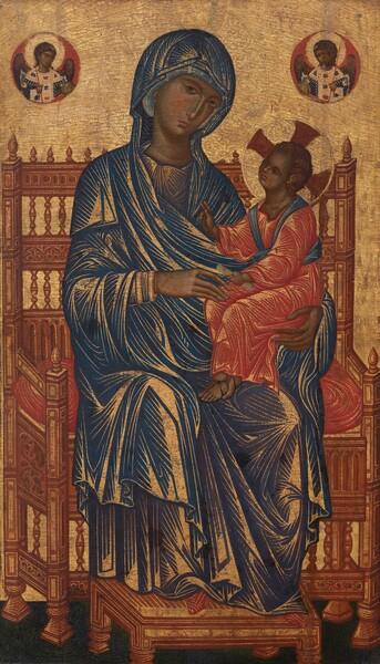 A woman sits on a wide, high-backed throne with a child on her lap against a gold background in this vertical painting. Their peachy skin is deeply shadowed with greenish gray. To our left of center, the woman’s body nearly fills the panel as she sits with her shoulders angled slightly to our right. She tilts her head in that direction as she gazes at us from the corners of almond-shaped, hazel eyes under arched brows. She has a slender face with a long nose and a petite coral-red mouth. A marine-blue mantle covers her head and wraps around her body. The mantle has fallen open at the neckline and the right knee to reveal her dark, navy-blue robe underneath. The child sits upright in the crook of her left arm, on our right. Her left hand cradles the child’s bottom while her other hand, to our left, rests delicately on his knee. The child faces our left and tilts his head to look up at the woman while reaching his far hand to her with two raised fingers. A bone-white scroll is clutched in his near hand. He has wavy, chestnut-brown hair and large, dark eyes. He wears a tomato-red robe and thin, black sandals. A spruce-blue sash wraps around the shoulders and waist of the robe. The folds and creases of their garments are suggested by densely spaced gold lines that bend in angular curves around their knees, legs, and arms. In pointed red shoes, the woman rests her feet on a stool just before the wide, ginger-brown throne, which is decorated with inset camel-brown and tan squares and rectangles. The back of the throne alternates between bands of carved decoration and spindles. Teardrop-shaped finials line the back. The woman and child have halos incised into the gold background beyond them. The child’s halo is divided by three, wide, garnet-red rays. Winged angels with gold halos in brick-red circles hover in the upper left and right. The glimmering gold background is worn in some areas and is cracked throughout.