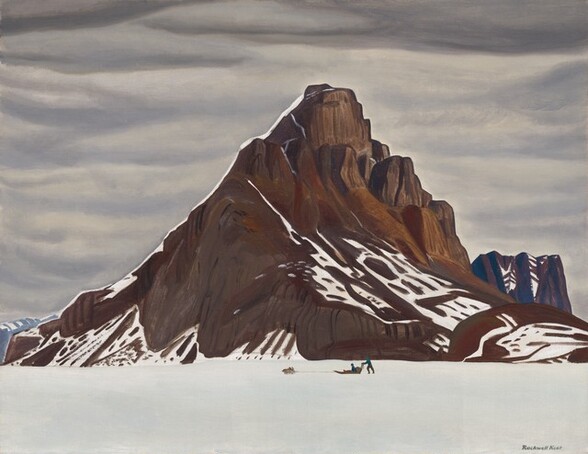 A tall, rocky, pyramid-shaped mountain rising sharply from flat field of snow and silhouetted against bands of steel-gray clouds nearly fills this horizontal landscape painting. Narrow bands of snow rest in the crevices of the dark brown mountain, especially on the cliff-like face to our right. A much lower, flat-topped butte in the distance to our right has cobalt-blue shadows. Near the foot of the mountain and at the bottom center of the composition, one person, tiny in scale, rides in a sled pulled by several dogs while another person pushes at the back. The horizon comes less than a quarter of the way up the composition and the sky above and around the mountain is a blanket of gray clouds shaded indigo blue on their undersides. The artist signed the work with dark paint against the white snow in the lower right corner: “Rockwell Kent.”