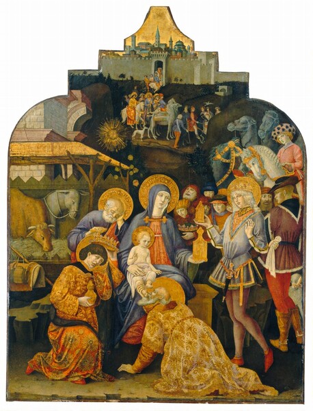 Dozens of people form a line starting from an opening to a city wall or building in the background to a rustic shed-like manger close to us to pay homage to a seated woman holding a baby on her lap in this vertical painting. All of the people have pale white skin. The top edge of the panel is shaped so it has two rounded sections like shoulders leading to a stepped, crown-like form with an inward curving triangle at the top. A nickel gray, crenelated stone wall of a distant city is nestled into the top, stepped section, with a glimmering gold sky above filling the uppermost triangle. Tile-roofed and domed buildings and a few towers appear densely packed beyond the wall. People on foot and horseback create a line from an arched opening in the wall towards us and to our right. Three of the people on horseback in the distance wear long robes and have gold halos. The line of people winds behind a tall, narrow hill to our right and it continues close to us. Two horses, two camels, and several people wait to the right but our attention is drawn to the trio in the foreground, Mary, Jesus, and Joseph, and the three men waiting on the infant, the Three Magi. Mary wears a lapis blue mantle covering her head and shoulders over a petal pink dress and she sits on a wooden or stone chest in the center of the painting. Her body faces us but she turns her face to look with pale blue eyes towards the hexagonal gold vessel that tapers to a flame-like finial she holds in her left hand, on our right. The blond infant sitting in her lap is covered only with a white cloth around his waist, and he looks towards the vessel as well while holding up the index and middle fingers of his right hand. To our left and slightly behind Mary, a balding man with white hair and beard and wearing a blue garment under a red robe sits with his head propped in his hand, looking down. His opposite hand rests on what might be the handle of a crutch or staff. The man, woman, and child have gold halos with what appears to be writing. The three Magi also have gold halos and they all wear scarlet shoes. The oldest kneels before the woman and kisses the baby’s feet. He has a long light gray beard and is balding. He wears a brocade-like gold robe over pale brick-red sleeves. A clean-shaven man with dark brown hair and wrinkles around his mouth kneels to our left as he raises the jewel-encrusted gold crown from his head. He wears a gold and red floral-patterned garment and holds a rounded vessel, also with a flame-like finial. A younger, clean-shaven man with smooth features and shoulder-length curling blond hair to our right also wears a gold crown. A dagger hangs from the waist of his sky-blue tunic and his leggings are pale plum-purple. Both arms are bent to his hands are held up, and in his right hand, he holds another tabernacle-like gold vessel. The shed-like manger to our left houses a donkey and bull munching hay. A gold sunburst floats above the roof, which seems to be built up against the stone wall of a building. The landscape beyond the people is painted with pine and moss greens and brown.