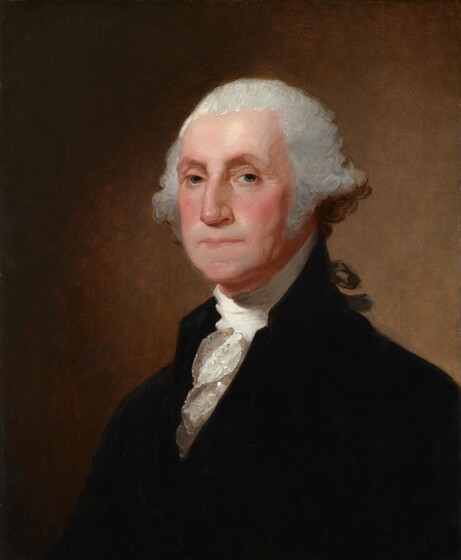 Shown from the chest up, a cleanshaven, middle-aged man with pale skin and silvery gray hair, wearing a white, ruffled shirt under a velvety black, high-necked jacket, looks out at us in this vertical portrait painting. His body is angled to our left, and he turns his face slightly to look at us with gray eyes under slightly arched eyebrows. He has a long nose and his thin lips are closed in a straight line. Shadows define slightly sagging jowls along his jawline and down his neck. His light gray hair is pulled back from his forehead and swells in bushy curls over his ears. Part of a black ribbon seen beyond his shoulder ties his hair back. Light illuminates the person from our left and creates a golden glow on the light brown background behind him.