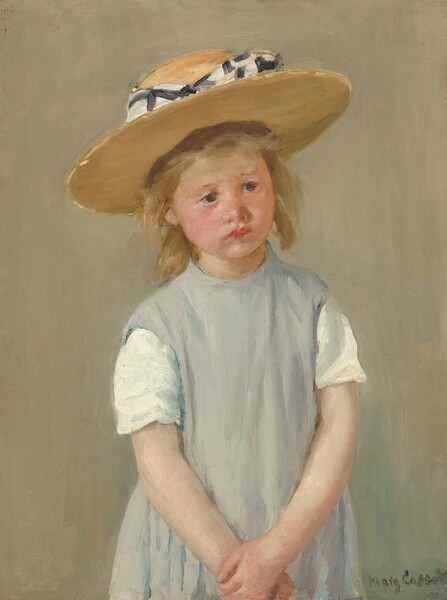 Shown from the waist up, a young girl wearing a slate-gray dress and straw hat stands with her hands clasped in front of her in this vertical portrait painting. The girl has light, peachy skin, and her cheeks are lightly flushed. Her body faces us but she tips her head slightly to her right, our left, and looks off into the distance with dark brown eyes. Her faint eyebrows drawn together, and her cherry-red, full lips slightly turn down at the corners. She has a button nose and a rounded chin line. She has dark blond, straight, shoulder-length hair under a wide, flat-brimmed straw hat. The hat is wrapped around the crown with a checkered white and black bow. Her shoulders slope down as she holds one wrist with the other hand down in front of her. She wears a jumper over a shirt with short white sleeves. At first glance the jumper appears pale gray but closer inspection reveals strokes of pale lilac, ivory white, and cobalt blue. The girl’s features and clothing are painted with loose, visible brushstrokes, and the background behind her is painted with vertical strokes of tan blended with faint green. Short dabs of brighter gold and butter yellow give the impression of sunshine on the brim of the hat and in the girl’s hair. The artist signed the work with loose letters in the lower right corner, “Mary Cassatt.”