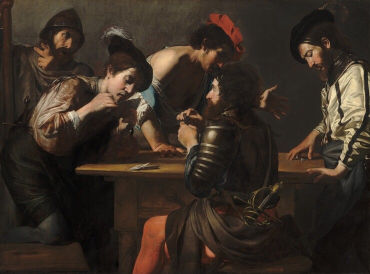 Five pale-skinned men gather around a rectangular table playing cards and dice against a dark, smoke-gray background in this horizontal painting. Light illuminates the scene dramatically from the upper left, creating bright areas and deep shadows. The two men closest to us play cards. One sits on our side of the table and faces our left in profile, wearing a gleaming, dark, armored breastplate and sleeves over scarlet-red tights. He has a dark brown beard and short, dark hair. He holds his stacked playing cards close to his chest, and he pulls the front one up with a forefinger and thumb as he looks at the man across from him. The young man near the left edge of the composition faces our right, almost in profile, as he half-kneels on his seat. He leans over the table, propped on one elbow. His other hand, closer to us, brushes the underside of his chin as he looks down at his cards. His right cheek and ear are brightly lit and much of the rest of his face cast into dark shadow, though there is a faint suggestion of a goatee around his parted lips. He wears a floppy, feathered cap, a bronze-brown shirt with full sleeves, and dark breeches over gray stockings. A bearded man with a tanned complexion stands behind the young man to our left. He looks toward the other end of the table at the dice players, and holds up a hand with two fingers extended. He wears a pointed metal helmet and holds a tall wooden staff with his other hand, along the left side of the canvas. Wrinkles line his forehead and create creases around his open mouth. Opposite us, two men look down at two small dice on the table. One man stands at the short end of the table to our right, with his right fingertips resting on the table over the dice. He wears a floppy, feathered cap over dark hair, and his brown beard is trimmed. His dark eyebrows are lowered and he has a long, straight nose. His ivory-white shirt has vertical black stripes and shimmers in the light. A metal collar, a piece of armor, rests around his neck and his hips are wrapped in a charcoal-gray cloth before being lost in the shadows under the table. In front of him, seen between the two card players, the fifth man faces the other dice player, leaning with his right hand on the table and holding up his other hand, palm out and fingers outstretched. His shoulder is bare where his cream-colored shirt has slipped down, and he wears a ruby-red, slashed, floppy hat. The light illuminates the back of his shoulder and side of his face, and the rest of his face is shrouded in shadow but we can see his mouth is open.