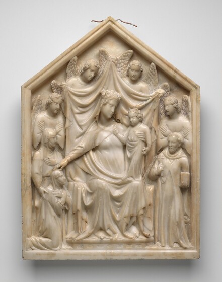 Three women, a man, child, and four winged angels are carved in relief on a panel to occupy a shallow space in this white marble sculpture. The group fills the panel, which is square on the bottom and comes to a triangular point at the top. The people have narrow, almost slitted eyes, straight noses, and thin lips. One of the women, Mary, sits on a throne at the center holding a child, Jesus, who stands one of her knees. Mary wears a crown, and her robes drape to the floor. One hand wraps around Jesus’s torso. He holds something down by his side with one hand and reaches the other up with the first two fingers raised toward a woman, Queen Sancia, who kneels in the lower left corner of the panel. Mary reaches her other arm out to touch Queen Sancia’s head as well. The queen and others in the scene are smaller in scale than Mary. Queen Sancia faces our right in profile as she looks at Jesus with her arms crossed over her chest. She and the woman standing behind her both wear veils that cover their foreheads, chins, and necks. The standing woman touches Queen Sancia’s shoulder with one hand and holds the other to her own chest. A man standing on Mary’s other side, in the lower right corner, wears a hooded robe and holds a book and a cross. He has a beard, and his hair is cut into a ring around his head. Winged angels stand with hands held across their chests behind the man and Queen Sancia. Two more angels hold up a cloth behind Mary and Jesus. The edges of the panel are carved to resemble molding.