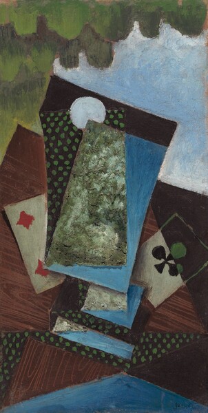 We look down at a wooden tabletop with two playing cards among stacked rectangles and wedges in this vertical, abstract painting. The two playing cards we can make out are a four of diamonds to our left and an ace of clubs to our right. The ace shifts from the traditional black club on a white background to a moss-green club on a black background on the top half. The other rectangles could be upside-down cards, though they are larger in scale than the face-up playing cards. These shapes are made with pea-green dots on a black background, areas of textured silvery olive green, and sky blue. The cards lie on a mostly complete corner of a table painted with wood grain, but triangles of wood grain, green polka dots, and blue intersect and bisect each other. A wide fern-green form with rounded lobes hanging from it fills the upper left corner, perhaps representing a tree. The area to its right is filled with baby blue edged with white. The artist signed the lower right, “Juan Gris.”