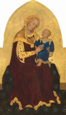 A young woman, holding a baby in her lap, sits on a wide bench draped with a patterned midnight-blue fabric in this vertical panel painting. The panel is rectangular at the bottom and becomes a pointed arch at the top. The woman and baby both have fair skin tinged with peach, and halos inscribed on a gleaming gold background. The woman’s body is angled to our right and she tilts her head in that direction to look down at the child. She has a slender, oval face, with hazel-brown eyes under thin brows, a long nose, and coral-pink lips. A sliver of blond hair peeks out from the honey-gold cowl that covers her head, neck, and shoulders. The cowl is layered over her gold-trimmed, burgundy-red robe, which has an opening through which her right arm, closer to us, reaches to support to the child. That arm is covered by a long, gold sleeve patterned with scalloped brick-red and marine-blue designs and smoke-grey flowers. The word “MATER” is inscribed on her neckline and “AVE MARIA GRATIA PLENA DOM TECV BEN” along the bottom hem. On the woman’s lap, the child is angled to our left with the woman’s slender hands wrapped around his torso. His mouth is slightly open as he tilts his head up to look at her. His right hand, on our left, reaches up to gesture at her neckline. He has wavy, blond hair and hazel eyes under faint brows, a small nose, and peach-colored lips set in a round face. He wears an ankle-length, cobalt-blue tunic trimmed with bright gold. The fabric on the bench is covered with cobalt-blue and crimson-red flowers, and pools around the seat and across the floor.
