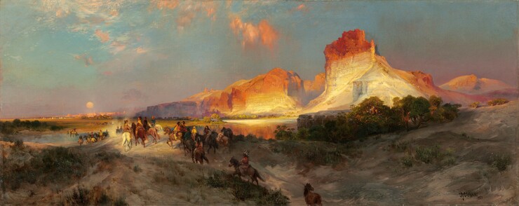 Sheer, vertical, cliffs, brightly lit in cream white and rust orange by the low sun, tower over a band of people riding horses into the distance in this long, horizontal landscape painting. The glowing cliffs dominate the upper right quadrant of the painting. They lighten from burnt orange along the jagged tops to flame orange down the steep sides, and are and warm, parchment white near the earth. One tall, narrow promontory to our right looms over a range of lower, rounded cliffs. As the cliffs move into the distance, they are shrouded with a lavender-purple haze. The land closest to us dips into a shallow valley at the bottom center of the composition, leading away from us. The dirt-packed earth is dotted with pine-green, scrubby bushes and vegetation and a grove of low, gnarled trees a short distance to our right. One chestnut-brown horse walks along the path at the bottom center of the composition, lagging behind a cluster of at least two dozen horses and riders winding into the distance. The horses range from ivory white to tawny brown and charcoal gray. The riders are loosely painted so some details are indistinct, but they all seem to have brown skin and dark hair. They wear feathered headdresses and garments in teal blue, fawn brown, or golden yellow. They ride over a low hill toward a crystal-blue river, and then back along a flat expanse toward a row of miniscule, triangular tepees lining the horizon in the deep distance. The horizon comes halfway up the composition, and the tepees are backed by a row of rose-pink, flat-topped cliffs. A pale yellow disk hangs low in the sky, over the distant cliffs. The sky above deepens from soft, lilac purple along the horizon to ice and sapphire blue along the top. A few wispy clouds are burnished orange in the sunlight. The artist signed and dated the painting in the lower right corner, “TYMoran 1881,” with the T, Y, and M overlapping to make a monogram.