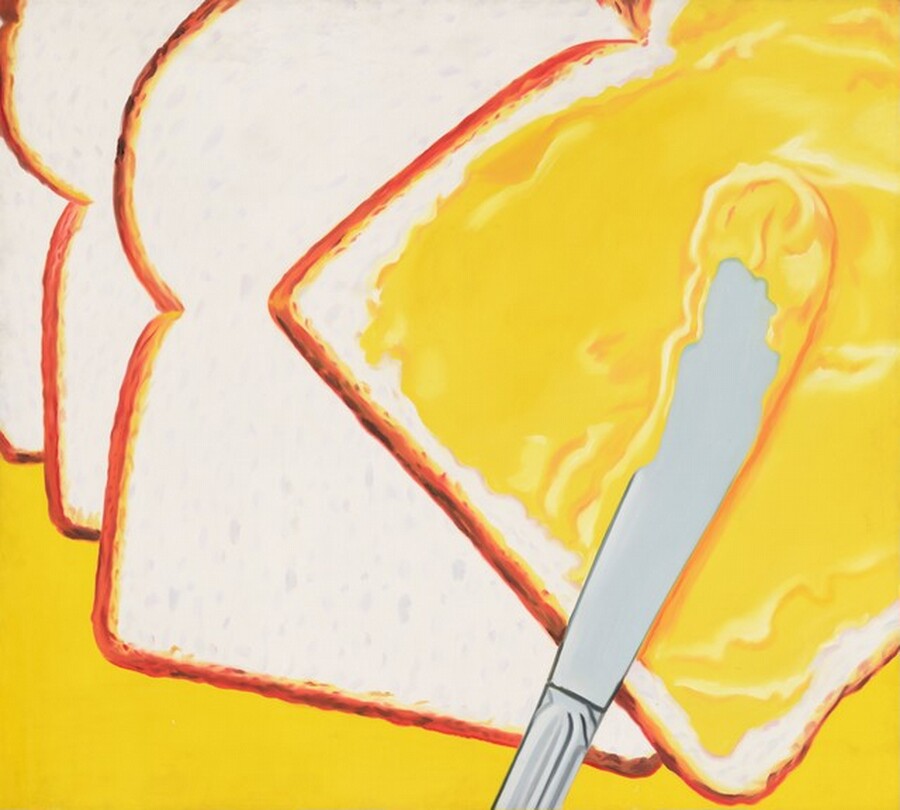 A silver butter knife rests across a slice of white bread so its rounded blade is covered with a layer of the vivid yellow spread, presumably butter, that covers the bread in this nearly square painting. The handle of the knife angles from near the bottom center of the composition up toward the top right corner. The handle is cropped by the bottom edge of the painting just below where it meets the blade. The bread on which it rests is also angled toward the upper right corner, so its curved top is cropped. Three more unbuttered slices of bread splay out like a fan beneath it, to our left and into the upper left corner. The bread is eggshell white with soft gray pockmarks to capture the air pockets in the crumb, and each slice has a deep, honey-brown crust. The glossy yellow butter glistens where the light catches it. The area around the slices of bread is the same vibrant yellow of the butter, along the bottom of the canvas.
