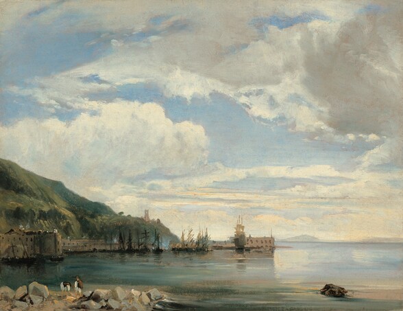 Cotton-white and slate-gray clouds drift and churn across a pale blue sky over a grassy hill that slopes to the edge of a placid body of water in this horizontal painting on paper. The horizon comes about a fifth of the way up the composition, and the scene is loosely painted so many of the brushstrokes are visible. Closest to us, two people with peach-colored skin are on a beach piled with smoke-gray and caramel-brown boulders. Both people wear dark vests over long-sleeved, white shirts and knee-length white pants. They are loosely painted so it is difficult to tell if they wear dark caps or have dark hair. One bends double to reach toward the sand, and the other stands and seems to watch, perhaps holding a brown sack over one shoulder. In the near distance to our left, a grassy hill rises steeply from the water’s edge from behind a stone wall. A couple touches of gray paint suggest smoke rising from chimneys in the town beyond. About a dozen masted ships, most with their sails tied up, line the harbor across the water from us. The water shifts from deep teal-blue in front of the hill, to our left, to aquamarine and fog-blue to our right. Ripples gently break around a brown boulder in the water near the lower right corner of the paper. The horizon is lined in the deep distance with pale gray mountains beneath the sweeping sky.