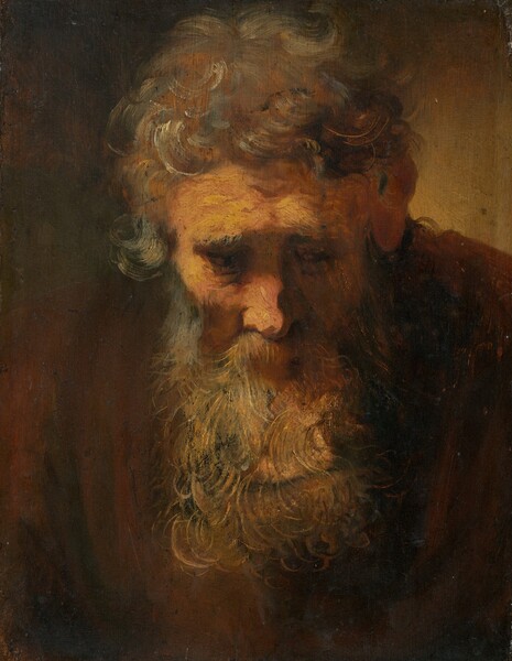 A man with thick, tousled gray hair and a long beard squared off at the bottom bows his head toward us in this vertical painting. His head and chest nearly fill the canvas against a background that lightens from black in the upper left corner to muted, amber brown in the upper right. Against the surrounding darkness, light falls across the peach-colored flesh of his forehead, right cheek, and nose. His heavy gray brows are drawn together, and they cast shadows over his deep-set eyes. The dark irises moving to our right are just visible. Loose brushstrokes sketch short, gray curls, a few of them streaked with white, covering the top of his head. One gray lock falling down his right temple curls up and out. Gray and tan strokes define individual curling strands of his beard and moustache. His chestnut-brown garment blends into the dark background.