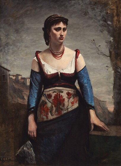 Shown from the knees up, a woman stands facing us as she turns her head to look off to our right in this vertical portrait painting. The woman has pale, peachy skin, deeply shadowed, hooded eyes, and a straight nose. Shadows fill the hollow of her high cheekbones, and she has a thin face. Her black hair is plaited and tied up and back under brown bands. Earrings hang from each ear, and she wears two strands of white and gray pearls and three red necklaces. Her shoulders slope down, and her arms hang by her sides. The garnet-red bodice of her dress is cut low over a white undergarment. Red straps loop up over her mostly bare shoulders. Sapphire-blue sleeves leave the shoulders exposed and have black bands at the cuffs, which fall short of her wrists. An apron tied around her waist is loosely painted with deep red flowers and dark green leaves against a parchment-brown background. Her long skirt is midnight blue in the shadows. She holds a shimmering object in her right hand, to our left, and rests her other hand on the brown stone wall that runs behind her thighs. A tree edges into the scene along the right, and a few white stucco houses with flat, red roofs cluster on a rocky hill in the distance behind the woman, to our left. The cliffs span most of the background and end in a sheer face near the right edge of the canvas. The sky is tinged with peach at the horizon glimpsed at the foot of the cliff but is mostly steely gray. The artist signed the lower left corner, “COROT.”