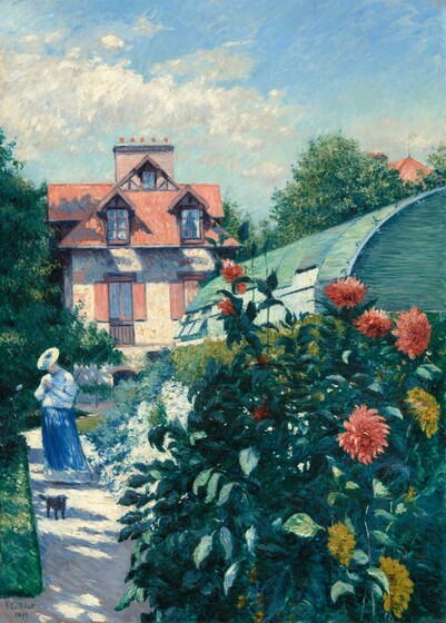 A woman stands on a sun-dappled path, which runs past a bank of blooming flowers and back to a cottage in this vertical painting. Close to us, the bush fills the lower right quadrant of the composition, where coral-pink and golden yellow dahlia blossoms flare like fireworks from among deep, spruce-green foliage. Sunlight from our left casts long violet-purple and steel-blue shadows across the white path, which runs parallel to the left edge of the canvas alongside a strip of trimmed lawn. In the near distance, the woman looks down at something in her hands at her chest so the brim of her hat angles down. She wears a pale blue jacket or blouse and a long, azure-blue skirt. A small black dog with wiry fur stands near the woman and looks at us. A greenhouse with a rounded, mint-green roof sits lengthwise on our right. Several windows are tipped open on the bottom half of the structure. Hedges of white, laurel-green, and peacock-blue flowers and bushes grow between the woman and the greenhouse. The house at the end of the path has a terracotta-orange roof, pale peach stucco walls, and dark orange shutters. Dense canopies of trees nestle each side of the house, and above, puffs of white clouds float against a watery, turquoise-blue sky. The artist signed and dated the painting in green in the lower left, “G. Caillebotte, 1893.”