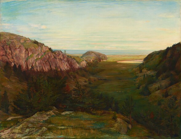 From a rocky ledge, we look down into a valley between two humped mountains that run into the distance ahead of us in this horizontal landscape painting. The area closest to us has golden yellow and sage-green grasses on a ledge of ash-gray stone. The land drops away beyond the ledge, into a valley, which is also deep in shadow. The conical tops of a few evergreen trees poke up on the far side of the stone ledge. The flat, grassy area between the mountains is moss and olive green. The mountain to our left curves down as it moves away from us, and the long side facing us is sheer, cinnamon-brown stone. The ridge continues into the distance and comes to an end in an emerald-green meadow, which runs parallel to a band of pale blue water. The mountain to our right is entirely in shadow, but the bristly ridge suggests trees. The water meets the ice-blue sky about two-thirds of the way up the composition.