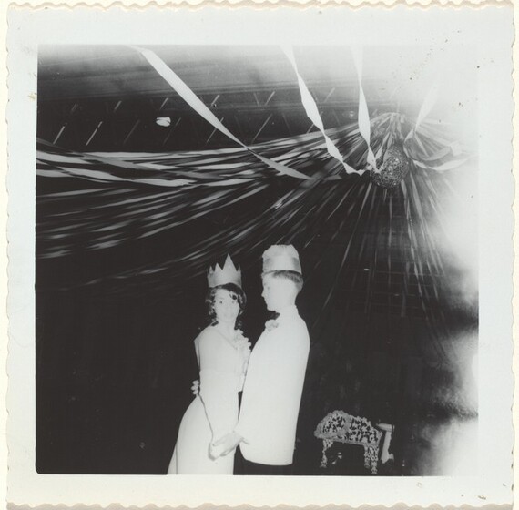 American 20th Century, Untitled (Adolescent couple wearing paper crowns at a dance), c. 1970