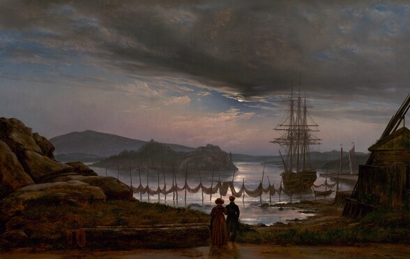 A man and woman look away from us toward a moonlit, rocky, coastal inlet with misty, midnight-blue mountains along the horizon in this shadowy, horizontal landscape painting. The sky fills the top two thirds of the painting. Along the horizon, pearl-white clouds float against a lilac-purple and pale pink haze. The sky deepens to ultramarine-blue above, and a band of nickel-gray clouds sweeps in across the top edge of the painting, to partially obscure the bright white moon, to our right of center. The moonlight gleams on the water below, which winds around the rocky coastline and small islands dotted with trees. Closer to us, the land stretches across the lower edge of the composition. Hulking, rocky formations line the left edge of the painting and a wooden structure with mossy growth along its roof sits to our right. Long poles lean against the building’s roof. At the lower center of the painting, and small in scale within the landscape, the woman, to our left, hooks her arm through the man’s elbow. She wears a long, rust-brown dress and a broad brimmed bonnet, while he wears a dark, knee-length coat and a round cap. They stand near the water’s edge, silhouetted against the bright reflections of the soft purple and pink sky above. Out in the water but close to the shoreline, brown nets hang like slings from a line of twenty-three, irregularly spaced poles. A three-masted ship is anchored near the shore to our right. Two rowboats, one with a person inside, and a few more sailboats are pulled up along a dock beyond the ship. The artist signed and dated the painting in the lower right, “Dahl Januar 1827”.