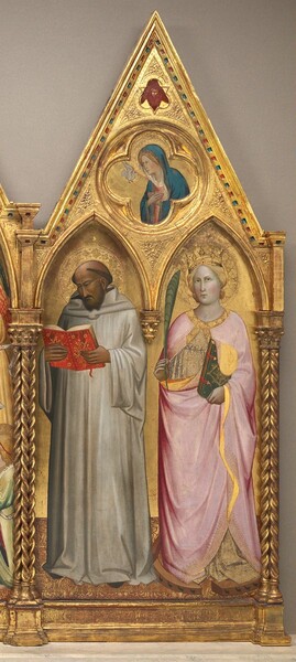 A man with deeply tanned skin and a woman with pale skin stand under pointed arches with a woman wearing blue in the triangular gable above, all against a gold background and set within a carved, gold frame in this vertical painting. This is the right wing of a three-panel triptych. The man on the left is mostly bald but has a fringe of tawny brown hair, a forked beard, and he wears a white robe. His body is angled slightly to our left. He looks down at a book held open in both hands. The cover is decorated with gold against a scarlet-red cover. The woman on the right faces us, looking at us with hazel eyes under thin brows. She wears a gold crown on her blond hair, which is gathered at the back of her neck. A pale pink mantle trimmed in gold wraps around her bronze and off-white brocaded gown which is visible at the neckline and hem. The edge of the mantle is turned back to reveal its goldenrod-yellow lining. She holds a green frond up in her right hand, to our left, and in the other hand holds a book with a forest-green cover embellished with gold. A wood wheel studded with short black spikes encircles her feet. Both saints have halos carved into the gold background, and they stand on a floor patterned with gold and burgundy red. The outer columns of the panel have pairs of twisted shafts that support the gable, which has a circle carved into its center. In that roundel is a woman and a dove inside a four-lobed quatrefoil. Shown from the waist up, the woman faces our left almost in profile. She has blond hair under the hood of her blue robe, and wears a rose-pink dress. Her hands are crossed over her chest, and she looks at a white dove flying next to her. Above the roundel, a face is surrounded by blood-red wings, set within a shape that has three lobes alternating with three points. Barely discernable, the panel is inscribed across the bottom below the saints, “S. BERNARDUS DOCTOR; S. K TERINA VIRGO.”