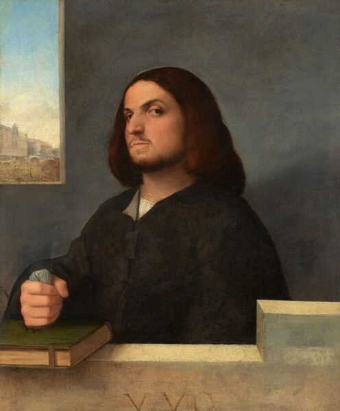 Shown from the chest up behind a stone ledge, a light-skinned man with a mustache, beard, and shoulder-length brown hair, wearing a black garment with voluminous sleeves, tilts his head back to look at us from the corners of his eyes in this vertical portrait painting. His body is angled to our left but he tips his head back to look past his rounded nose at us with dark eyes from under arched brows. His right fist, on our left, rests on a closed book bound in moss green, which is fastened with a metal clasp. The book rests on the ivory-white stone ledge, which steps up to a higher level to our right. He clenches a wad of nickel-gray cloth in the hand on the book, and his other arm rests by his side, extending out of view behind the ledge. His black, long-sleeved jacket has full sleeves and is open at the neck over a collarless white shirt. A squared opening is cut into the elephant-gray stone wall behind him to our left. A cityscape beneath a pale blue sky is visible in the distance out the window. The Roman characters “VVO” appear to be carved into the front face of the ledge, at the bottom edge of the canvas.