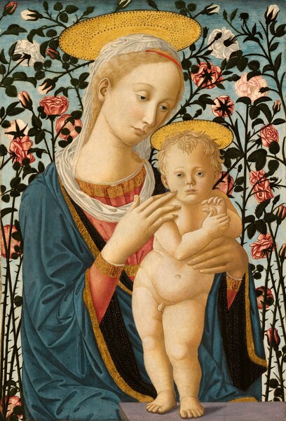 Shown from the lap up, a young woman sits behind the back corner of a gray, stone platform, supporting a small naked baby boy standing on the ledge in this vertical painting. Both have pale, almost golden skin tones and blond hair. The woman sits with her body angled to our right, and she tilts her head down toward the baby, looking past him with hooded, brown eyes. Her wavy hair is tied back and held with a thin red band above her forehead. A white veil over the crown of her head drapes down the back of her neck and wraps loosely around her shoulders. She wears a flowing, wide-sleeved robe of cobalt blue trimmed with a band of gold embroidery in designs resembling calligraphic letters. The navy-blue lining, seen at the sleeves and collar, is densely flecked with gold dots. The hems of her rose-pink dress, visible at her forearms and chest, are edged with gold embroidery and white lace. The baby stands on the ledge in front of the woman, slightly to our right. Her right hand, on our left, rests on the baby’s right shoulder with one finger brushing his cheek, while her other hand supports his other side at his waist. The child stands on pudgy legs with his left foot forward, hips sharply tilted down toward his left hip. His body faces us, but his brown eyes look over and past our left shoulder, into the distance. He has short curly hair, a round face and cheeks, and delicate facial features. His hands are raised to his chest so the thumb of his right hand touches the palm of his left. Flat, plate-like golden halos seem to rest atop both of their heads. Each halo has a black rim and is decorated with rings of dots. Filling the background immediately behind them, crisscrossing branches of a thorny rosebush fills the panel. More than two dozen white, pink, and red roses are shown in all stages, from bud to bloom, and the branches are lined with jagged-edged, deep green leaves. The roses are set against a cloudless sky that fades from powder blue along the top to nearly white along the bottom.
