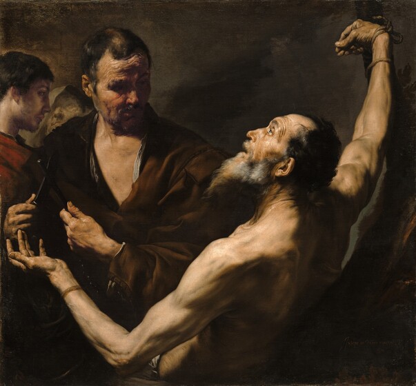 A group of four men with pale skin, shown from the waist up, almost fill this square painting. Light pours onto the scene from the upper left and falls across the upturned face of the bearded, bare-chested man, Saint Bartholomew, who is situated with his back facing us and his arms spread wide. In the top right corner, his right wrist is lashed to a pole that extends off the top edge of the painting. His other arm is bent at the elbow near the lower left corner, and he holds that hand palm up. His profile, facing our left, is bright against the shadowed background. His mouth is slightly agape, and his eyebrows are raised as he looks up toward the light that bathes his lithe, muscular body. His long beard is streaked with gray, and he has receding black hair. A second, broad-shouldered man, draped in a brown cloak, stands facing us behind and just to our left of Saint Bartholomew. The younger man holds a knife in one hand resting against a black, rod-like sharpener held in the other. He turns his head to gaze at Saint Bartholomew, his eyes deep in shadow. He also has a furrowed brow and a craggy, ruddy complexion. Two more men stand behind him, to our left, filling the left side of the painting. The man on the far left has smooth skin, a trimmed beard, and short brown hair. He stands in profile looking to our right and wears a cranberry-red cloak. Barely visible beyond him, to our right, is a man wearing a gray-green hood hiding half his face. His features are loosely painted and faint, but he also looks up, either toward the young man or the light from above. All four are surrounded by deep shadows against a brown background.