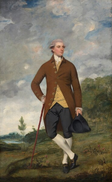 A clean-shaven, pale-skinned man with gray, powdered hair stands in the middle of a grassy landscape in this vertical portrait painting. He has smooth skin with hazel eyes under thick brows, a long nose, and his full, pale pink lips are closed. He stands facing us with his ankles crossed and his head turned slightly to look off to our right. A knee-length, ginger-brown jacket has a row of gold-colored buttons, the size of checkers pieces, down the front and lacy cuffs at the end of a row of three more buttons on each sleeve. One button is fastened across his chest over a white cravat and goldenrod-yellow vest patterned with tiny brown specks. His left hand, on our right, hangs down, holding a navy-blue tricorn hat next to navy breeches. White stockings cover his lower legs, and his black shoes have gleaming brass buckles. He leans his right hand, to our left, on the head of a wood walking stick, which is propped against that hip. The landscape around him is carpeted in shades of muted green with touches of golden yellow. White and dark pink flowers grow in clusters around his feet, and a grove of slender trees climbs a low hill on our right. Blue-green trees and vegetation stretch into the distance to meet a light blue body of water along the left edge of the painting. Low on the horizon, which comes about a fifth of the way up the composition, a mountain is hazy blue in the deep distance. Patches of vivid blue sky peek through swirling white, gray, and pale peach clouds that fill most of the background.