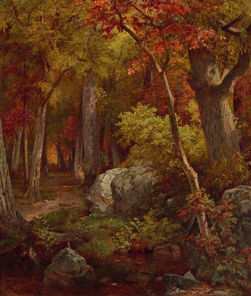 A dirt path winds through a dense forest with leaves that glow gold around silvery-gray boulders in this vertical landscape painting. Close to us, the boulders are partially covered with moss and growth in shades of green and russet red. Sunlight from the upper right catches a sapling crowned with flame-red leaves that angles in from the lower right corner of the painting. Beyond it leafy yellow-green shrubs crowd beside two more putty-gray boulders. The path recedes just left of center and is lined by trees covered with rough bark. The path ends at a fiery copper glow in the distance. The artist signed and dated the painting in the lower right corner: “WM. T. Richards Phil. 1863.”