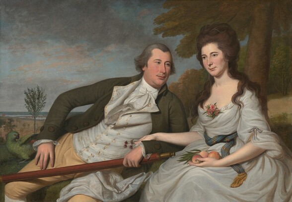 Shown from the knees up, a light-skinned man and woman are seated side-by-side on grassy rise in a landscape in this horizontal portrait painting. To our left, the man leans heavily toward the woman to our right, propped on one elbow near her hip. She sits upright, resting one hand over his forearm and wrist. The cleanshaven man looks at her with blue eyes under gray, arched brows. He has a straight nose, round cheeks, a hint of a double chin, and his pale pink lips are closed in a slight smile. He wears a forest-green coat, a white waistcoat embroidered with golden yellow, a white shirt and ruffled tie, and buff-colored breaches. His right hand, to our left, is propped loosely against his hip. Next to that hand, a green parrot stands with its wings lifted as it turns its head back over its body. The man’s other hand, near the woman, holds a long, wooden telescope. The woman looks off into the distance to our left with gray eyes. She has smooth cheeks, a delicate nose, and her pink lips also curl in a faint smile. A strand of pearls weaves through the brown hair loosely piled on her head and through the thick curls that fall over her shoulders. Her white dress is loosely draped around her body. An ocean-blue sash with gold stripes and fringe wraps around her waist, and a sprig of pink flowers is tucked into a fold at her neckline. She holds at least three peaches and a stem of leaves in her lap, and a spray of purple clover blossoms in her other hand, which rests lightly over the man’s forearm. A swath of white fabric, perhaps from her skirt, wraps up and over the man’s thigh, closer to her. Behind the woman, a tree grows on a low hill along the right edge of the canvas and off the top. The landscape opens into an expansive vista to our left with spindly trees growing in a low meadow that leads back to a body of water in the deep distance. Miniscule in scale, tiny boats and buildings line the water’s edge near the horizon. A few thin, silvery gray and petal-pink clouds skim across the pale blue sky.