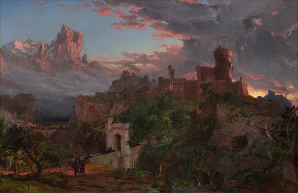 A turreted, sprawling stone castle, bronzed by the setting sun, crowns a rocky cliff at the center of this horizontal landscape painting. A round turret rises in the center of the castle’s jumble of blocky, square buildings. The buildings are dramatically outlined against a mass of roiling charcoal-gray and indigo-blue clouds, which are edged in peach, in the upper right corner. Barely noticeable amid the hulking structure, a scarlet-red flag flutters from a window in the tower overlooking a distant crag to our right. On that distant mountain, a column of amber smoke rises to mingle with the clouds above a bright band of sunlight on the horizon. Low trees and bushes grow around the base of the battlements. The land dips steeply toward us to a river below the cliff. Through the tangle of trees, a dirt road winds down the hill to a bridge of pale stone that crosses the river in front of us, to our left of center. Groups of helmeted horsemen cross the bridge, passing under a stone archway at its center. Near the bridge, tiny in scale, a herd of goats capers on the road near the horsemen as they ride on in a double column coming toward us along the clay-brown road. One rider carries a red pennant fluttering in the breeze. The riders wear ruby-red tunics and carry upright lances and shields. Light glints off their armor and helmets as they head to our right, toward the dark mass of tangled trees and rocky cliff on the border of the picture. A copse of low, gnarled trees grows near the opposite edge of the painting, to our left. Behind these trees and riders stretches a river valley spanned by another stone bridge. A cluster of people can barely be seen near and along that massive bridge in the distance. Beyond, buildings and a tall, square tower are lit by fires belching clouds of smoke. A heavy bank of gray clouds obscures the rest of the valley. Birds soar in the mist near a distant cliff, where flames and more smoke rise behind a boulder. In the deep distance to our left, a high, craggy cliff topped by a sprinkling of snow surges above the blanket of fog and clouds. In front of a clear, blue sky, it is also bathed in coral-red by the setting sun.